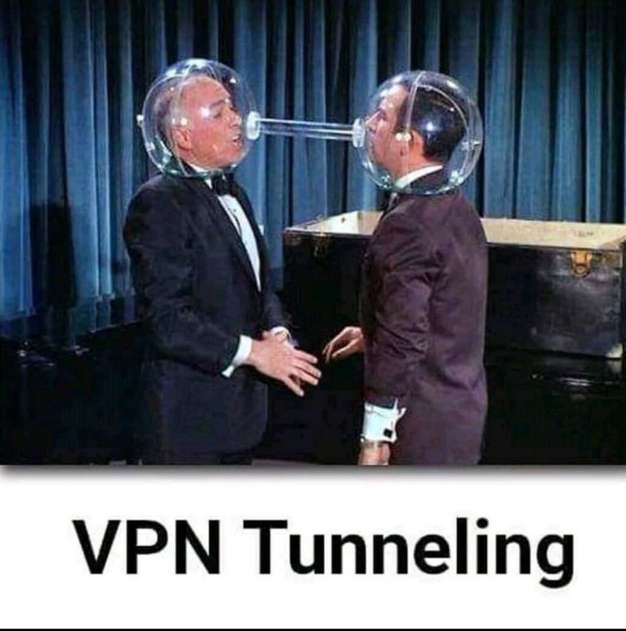 two tuxedoed men sharing one fishbowl space helmet, captioned "VPN Tunneling"